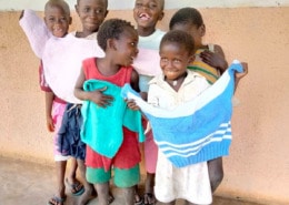 Donated fish and chip clothes for children in Uganda