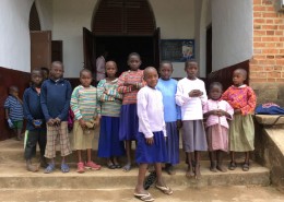 Group of children receiving new jumpers