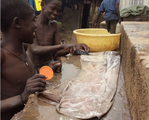 Street children washing their clothes