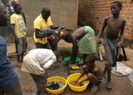 A group of street children washing clothes