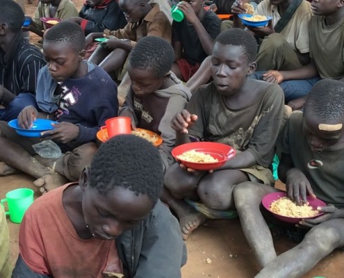 Feeding homeless children in Kampala