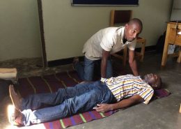 Rogers giving First Aid