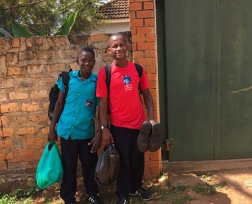 Two of the street children return to school