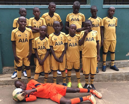 The street children in their Spurs football kits