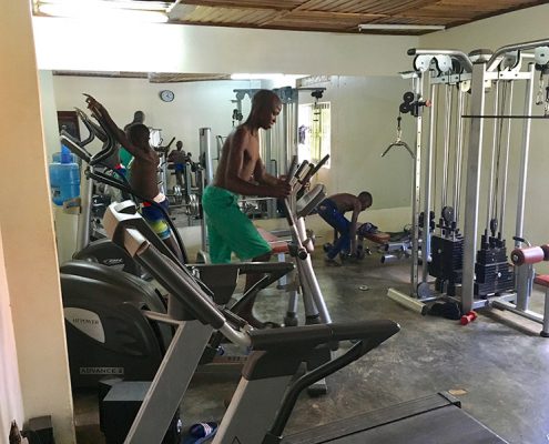 Some of the street boys using the gym
