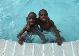 Two of the street children in the swimming pool