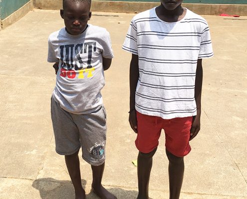 Two street children cleaned up