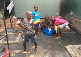 Street boys cleaning and having fun