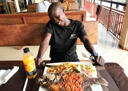 Street boy enjoying his food