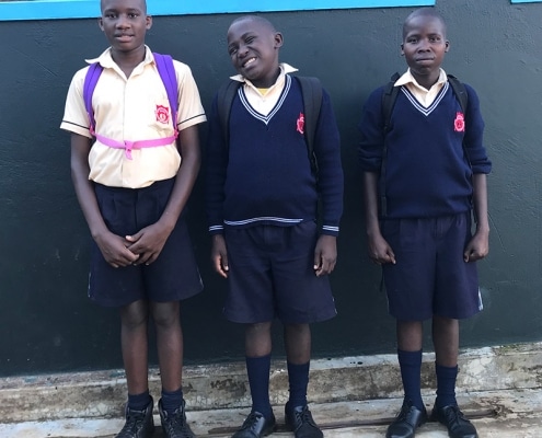 Three street boys returning from schools