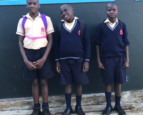 Three street boys returning from schools