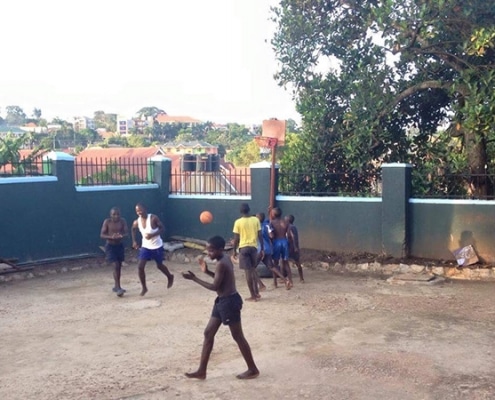 Street children playing basketball