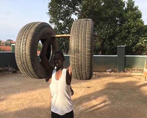 A street child showing his strength