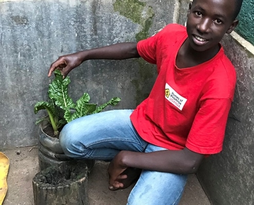 Our street boy Brian with his spinach