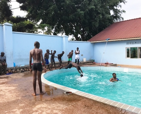 Street boys playing in the pool