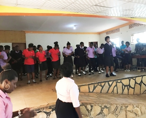 Children performing worship at school