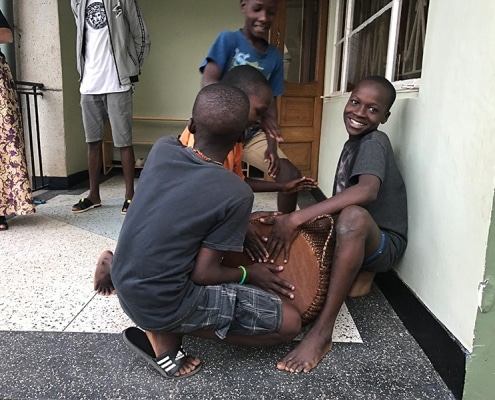The street boys receive a new drum