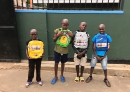 Four of our street children with new bags