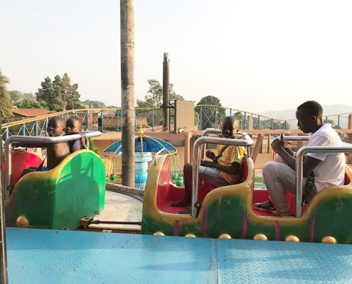 Street children on a fairground ride