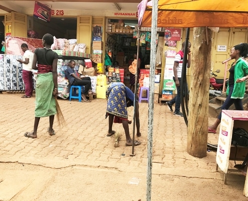 Girls collecting beans at the market