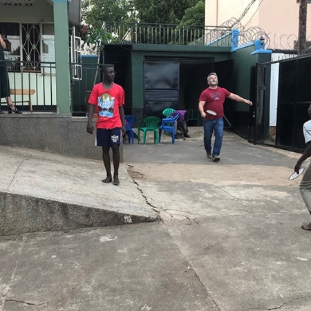 Street boys playing badminton with Ole