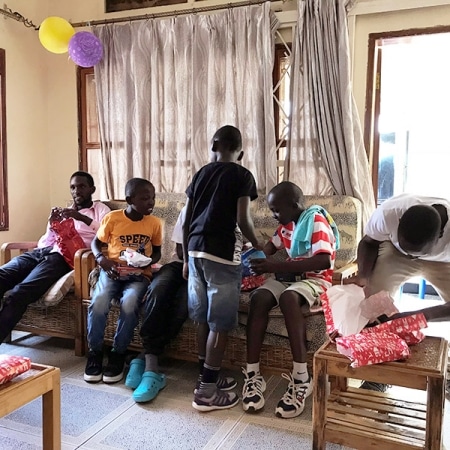 Street boys opening presents