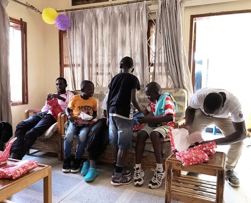 Street boys opening presents