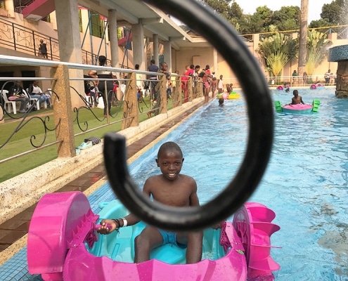 Streetboy playing in swimming pool