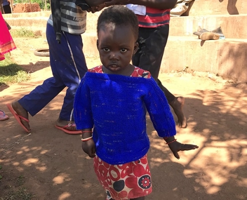 A child in a donated jumper