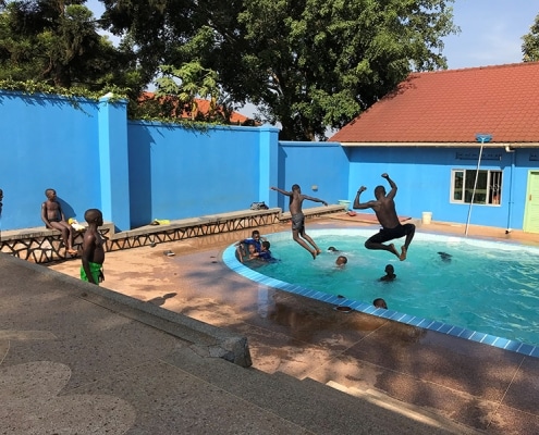 Street boys playing in the pool