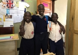 Three former street boys return home from school