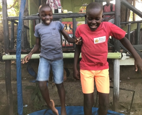 Two of our boys playing on a trampoline