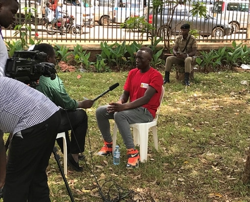 One of the street boys being interviewed