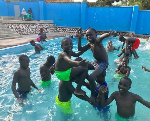 Street boys cooling off in the pool