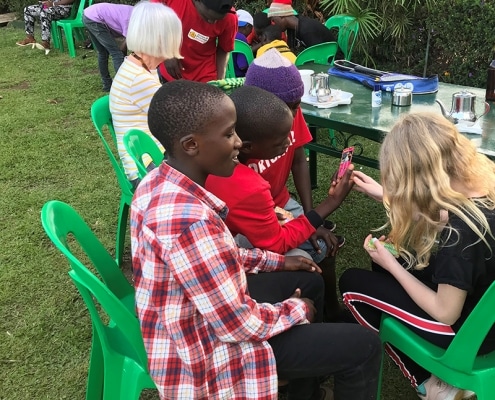 Visitors teaching street children