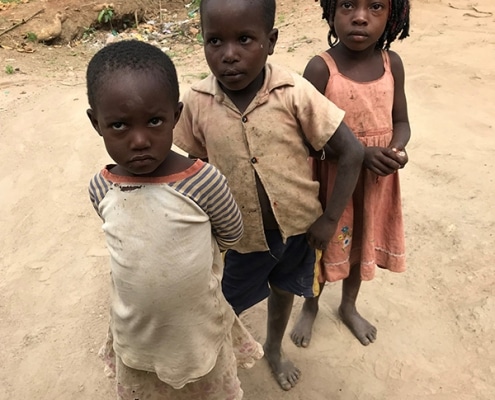 Ugandan children waiting for lollipops