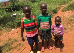 Ugandan children wearing donated jumpers