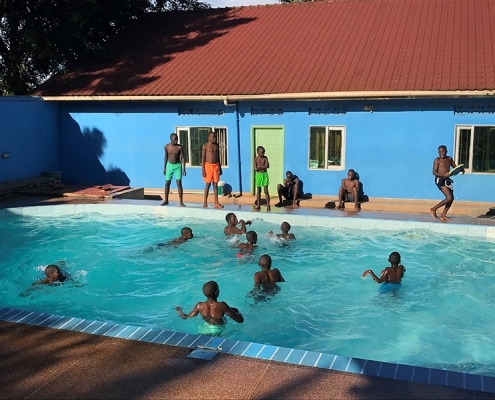 Street children playing in the pool