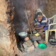 A Ugandan boy cooking lunch