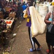 Street child carrying shopping home