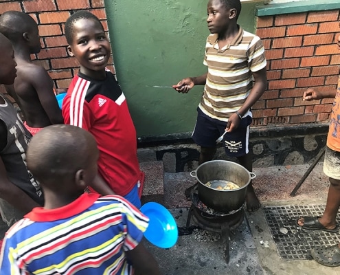 Street children cooking food