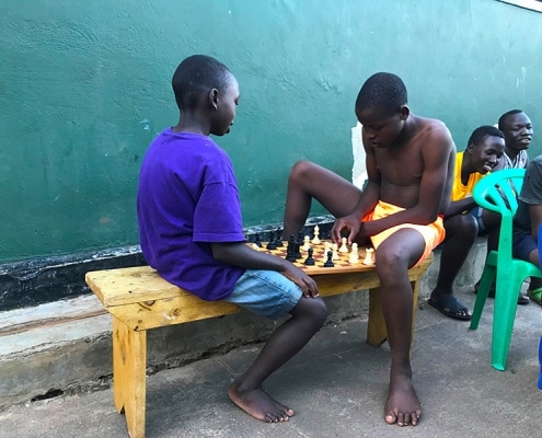 Street boys playing chess