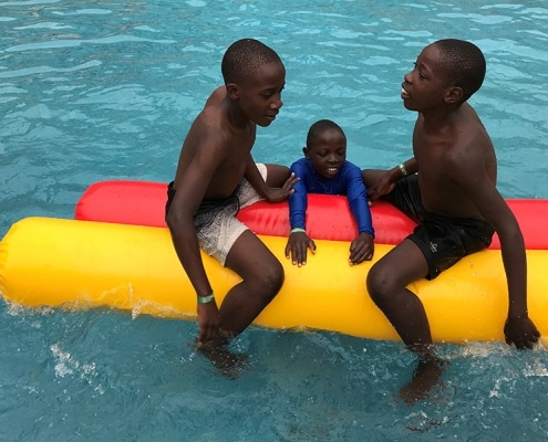 Three boys in the pool