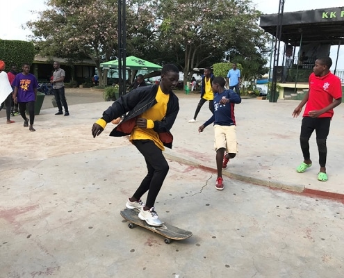 A Ugandan street boy skateboarding
