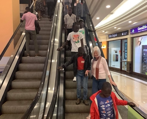 Street children using an escalator