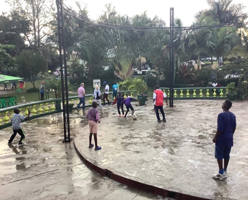 Boys playing after a downpour in Uganda