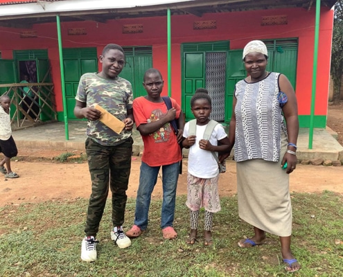Ugandan street boy and family