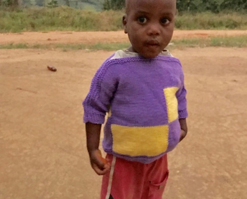 Child in donated jumper