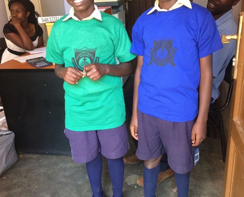 Two boys in donated sportswear