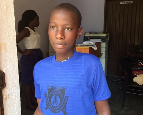 A street boy in donated clothes